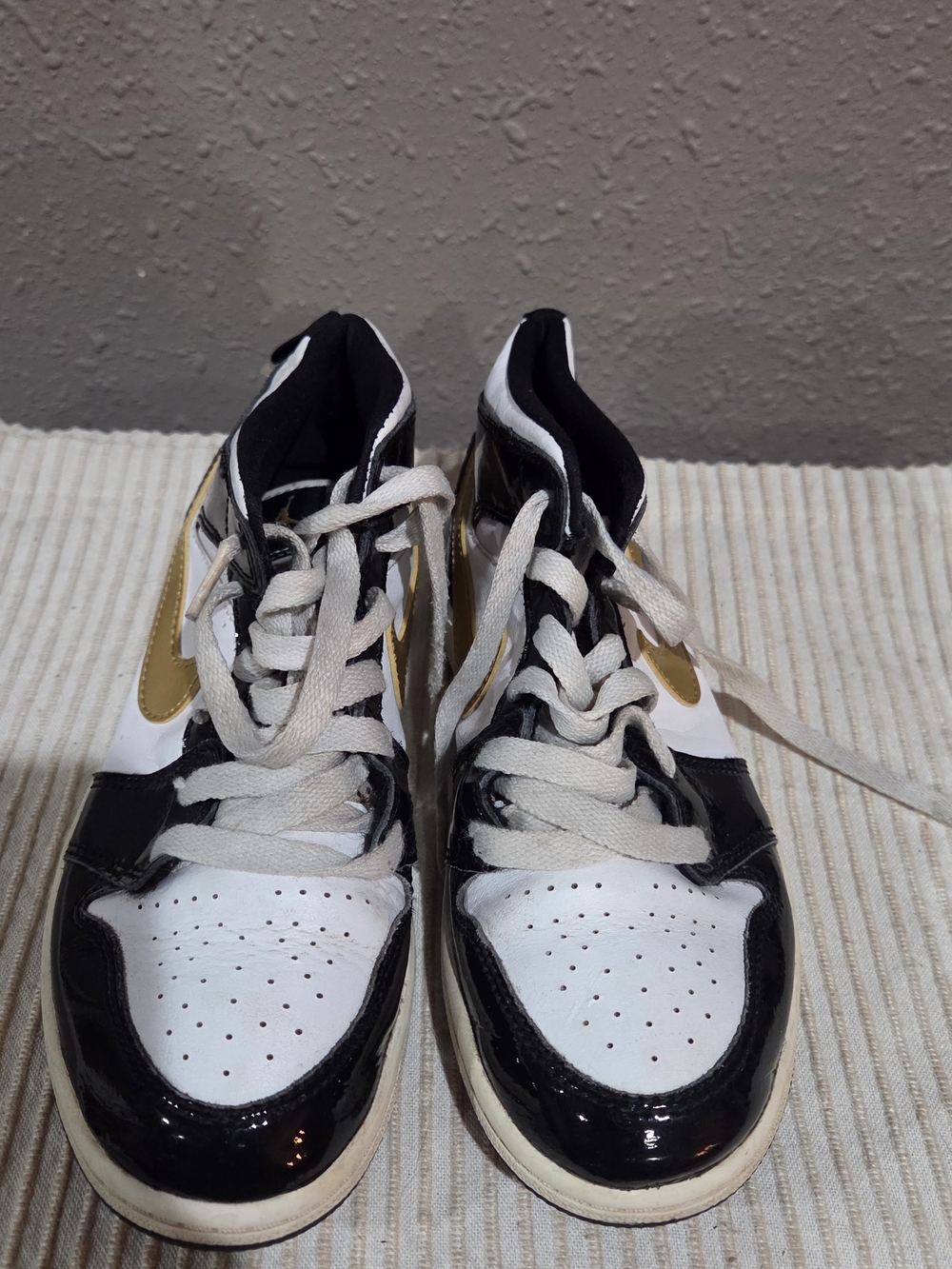 Jordan White, Black & Gold High-Top Sneakers